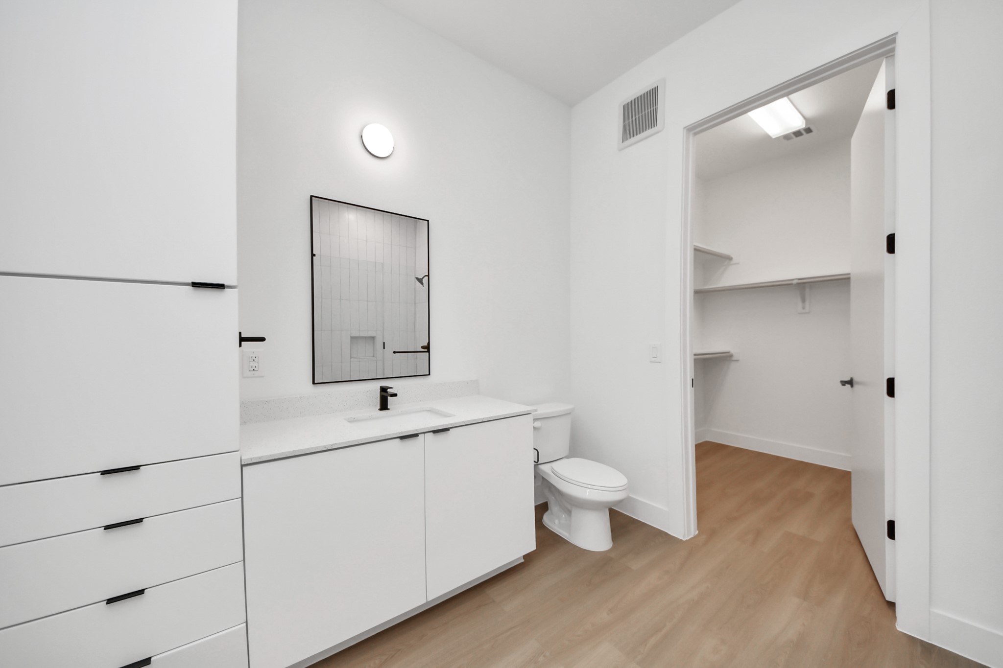 2810 Riverby Road, Unit 225 Houston, TX 77020 - Photo 17 of 47 a bathroom with a toilet sink and mirror