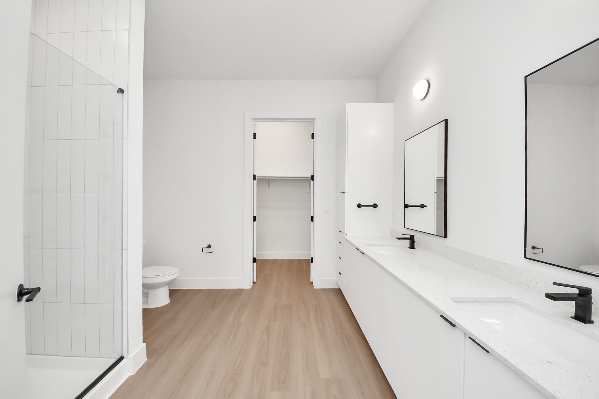 2810 Riverby Road, Unit 225 Houston, TX 77020 - Photo 25 of 47 a bathroom with a double vanity sink toilet and shower