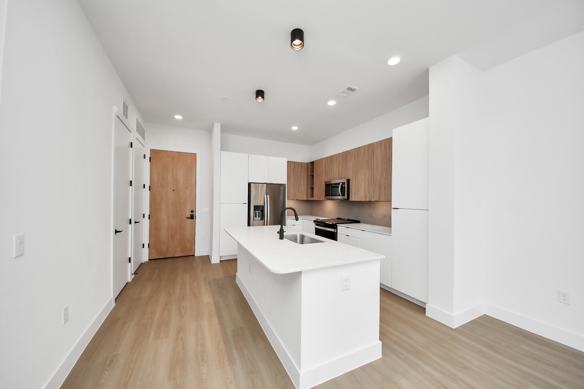 2810 Riverby Road, Unit 225 Houston, TX 77020 - Photo 8 of 47 a kitchen with a sink a counter top space stainless steel appliances