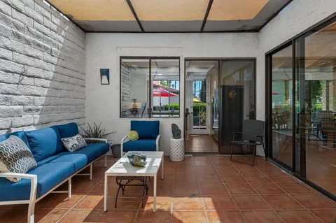 a kitchen with granite countertop white cabinets and a sink