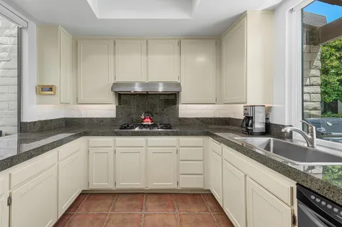 a swimming pool with outdoor seating and yard