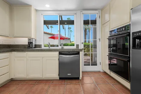 a view of a terrace with furniture and garden