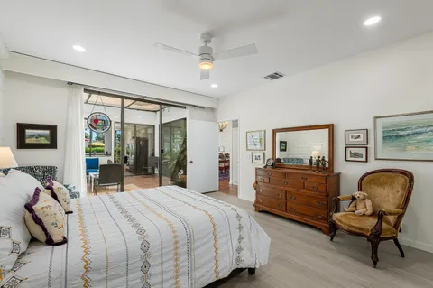 a bathroom with a double vanity sink a mirror and a bathtub