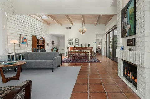 a view of a patio with table and chairs