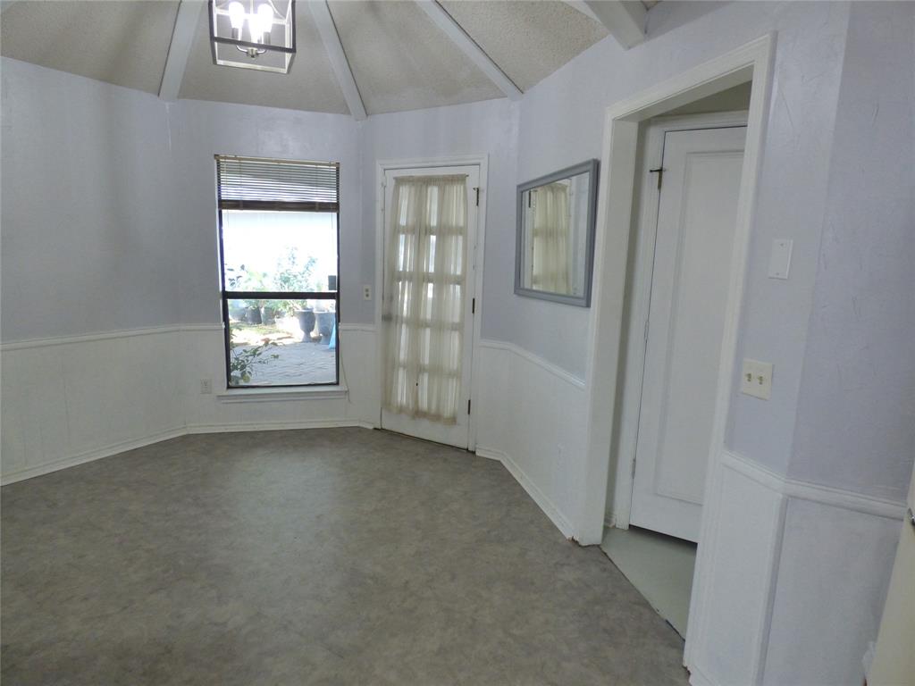 1506 East Peters Colony Road Carrollton, TX 75007 - Photo 12 of 33 an empty room with windows and closet