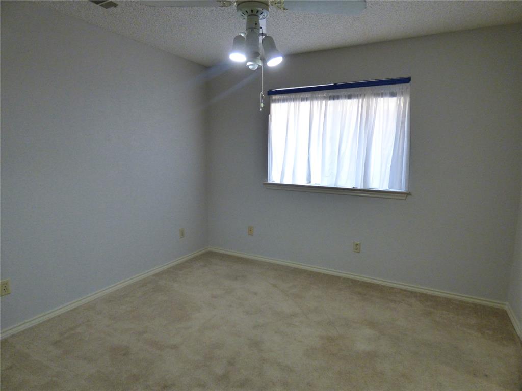 1506 East Peters Colony Road Carrollton, TX 75007 - Photo 21 of 33 an empty room with a window