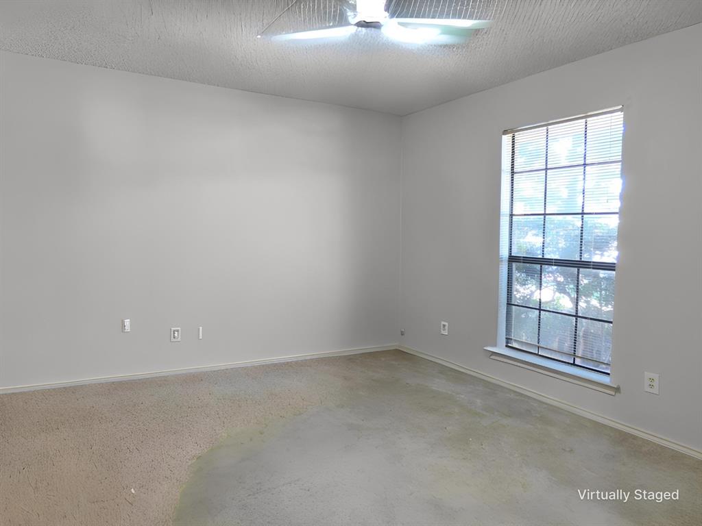 1506 East Peters Colony Road Carrollton, TX 75007 - Photo 23 of 33 an empty room with windows and closet