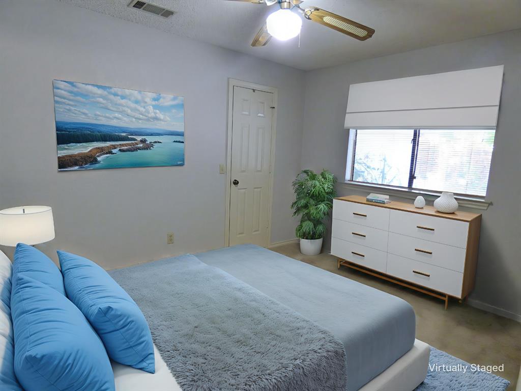 1506 East Peters Colony Road Carrollton, TX 75007 - Photo 24 of 33 a bedroom with a bed and a dresser