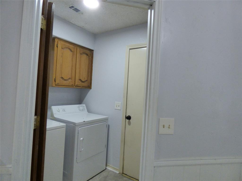 1506 East Peters Colony Road Carrollton, TX 75007 - Photo 29 of 33 a bathroom with a sink a toilet and shower