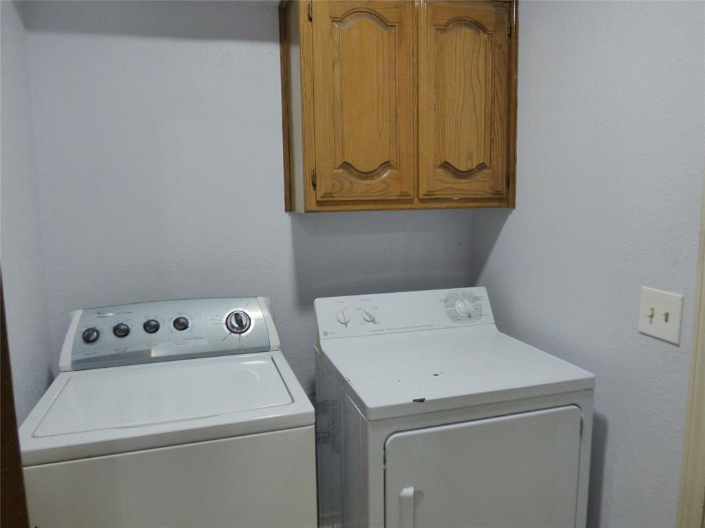 1506 East Peters Colony Road Carrollton, TX 75007 - Photo 30 of 33 a utility room with dryer and washer