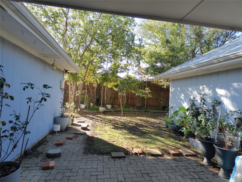 1506 East Peters Colony Road Carrollton, TX 75007 - Photo 31 of 33 a view of a backyard with garden