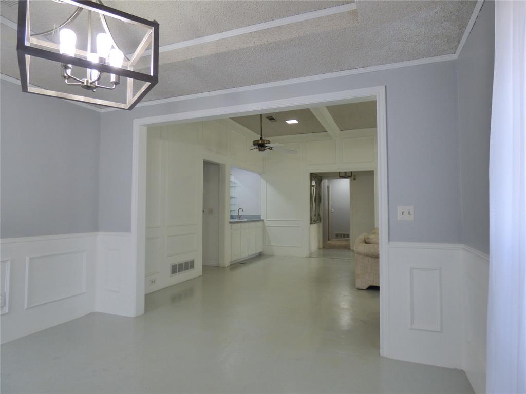 1506 East Peters Colony Road Carrollton, TX 75007 - Photo 5 of 33 en empty room with chandelier