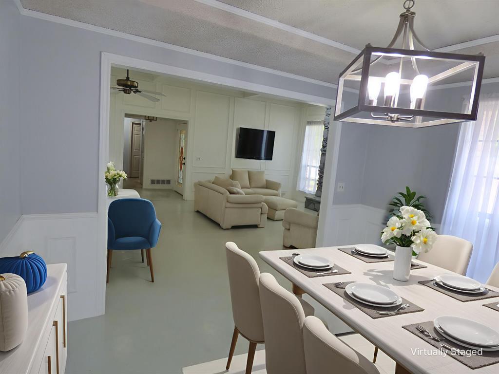 1506 East Peters Colony Road Carrollton, TX 75007 - Photo 6 of 33 a dining room with furniture and chandelier