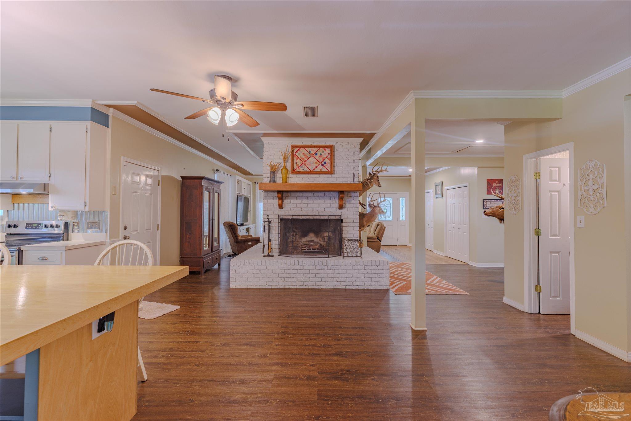 5049 Guernsey Road Pace, FL 32571 - Photo 28 of 61 a view of a kitchen and dining room
