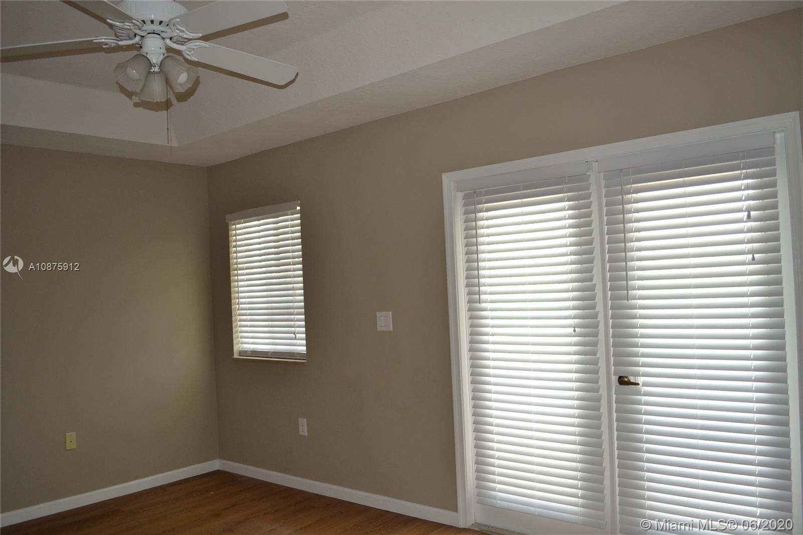 27951 Southwest 140th Avenue Homestead, FL 33032 - Photo 15 of 27 a view of an empty room with a window