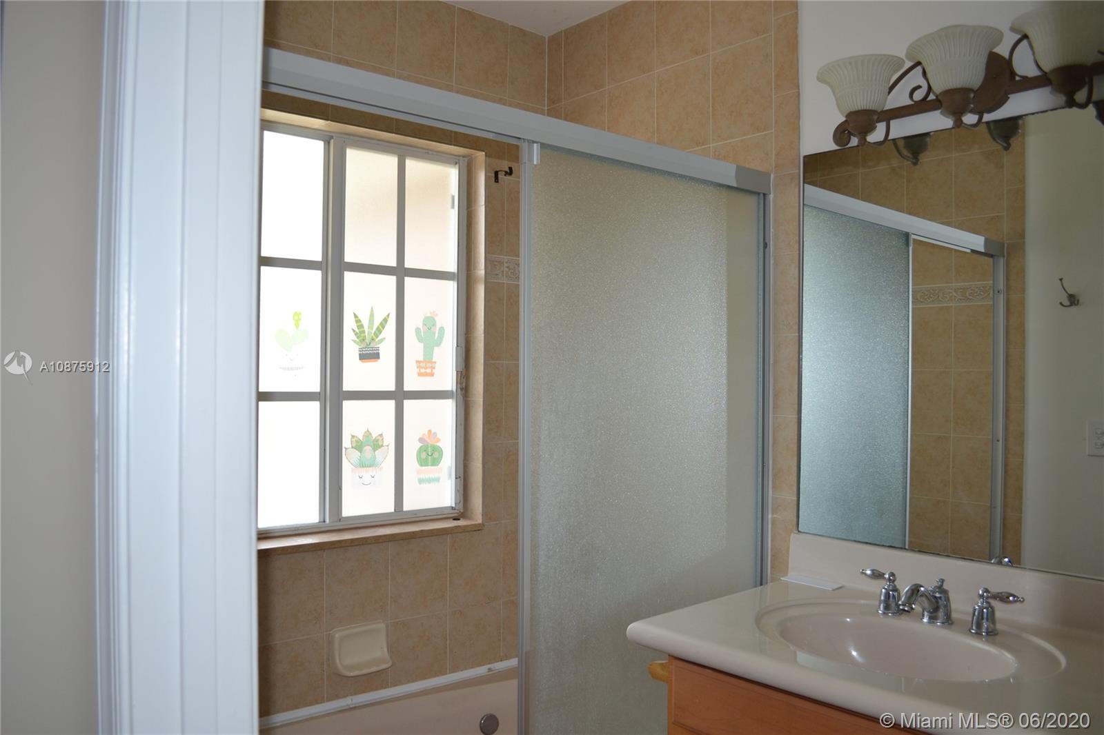 27951 Southwest 140th Avenue Homestead, FL 33032 - Photo 16 of 27 a bathroom with a granite countertop sink and a mirror