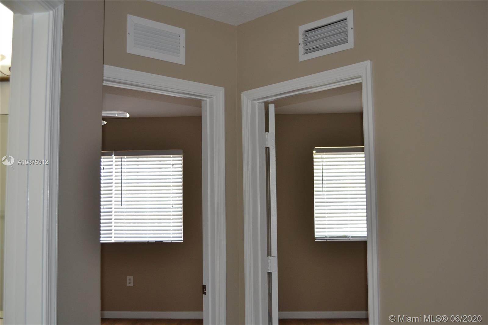27951 Southwest 140th Avenue Homestead, FL 33032 - Photo 17 of 27 a view of a bathroom that has a window in it