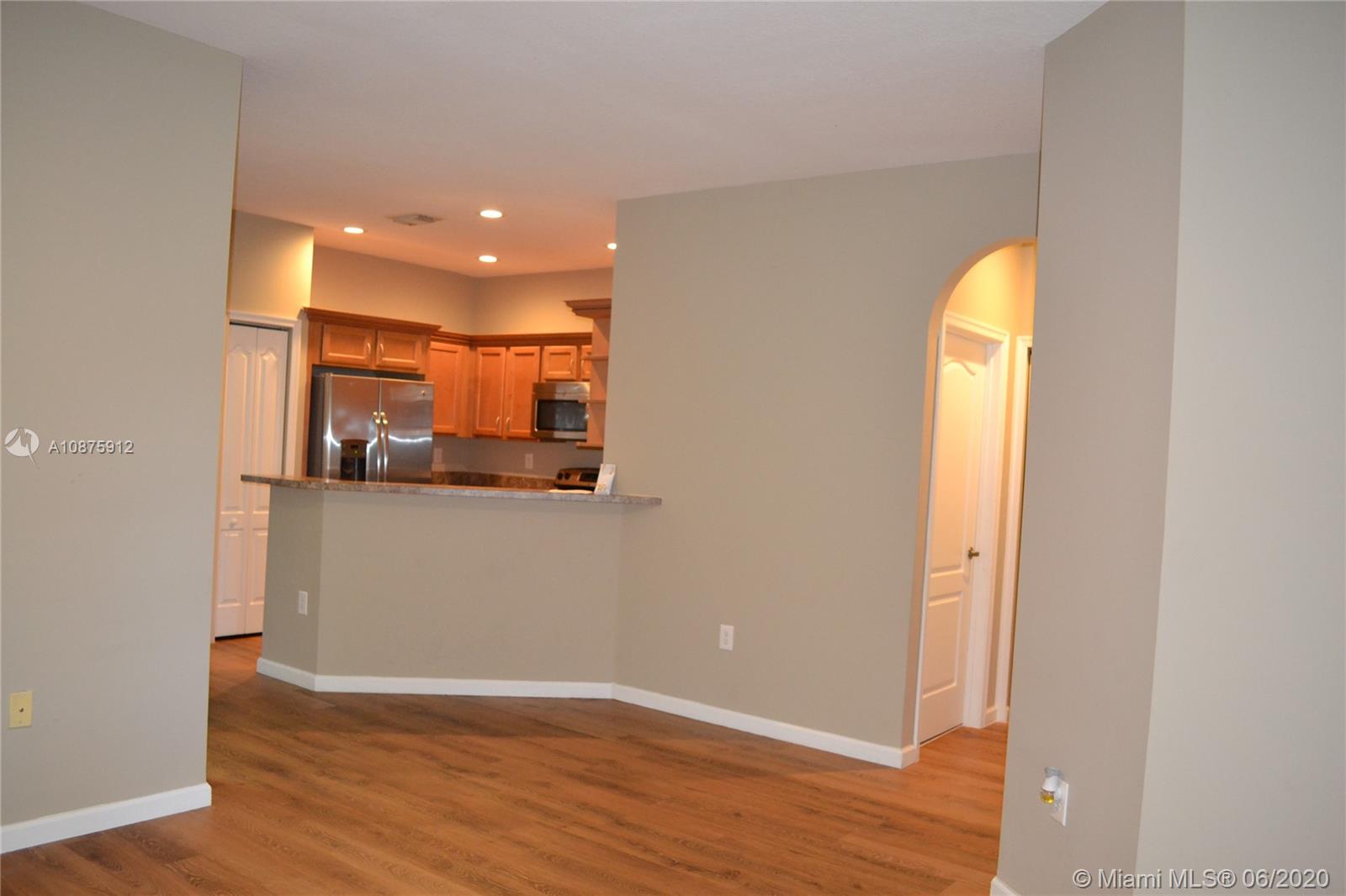 27951 Southwest 140th Avenue Homestead, FL 33032 - Photo 20 of 27 a view of a room with wooden floor and window