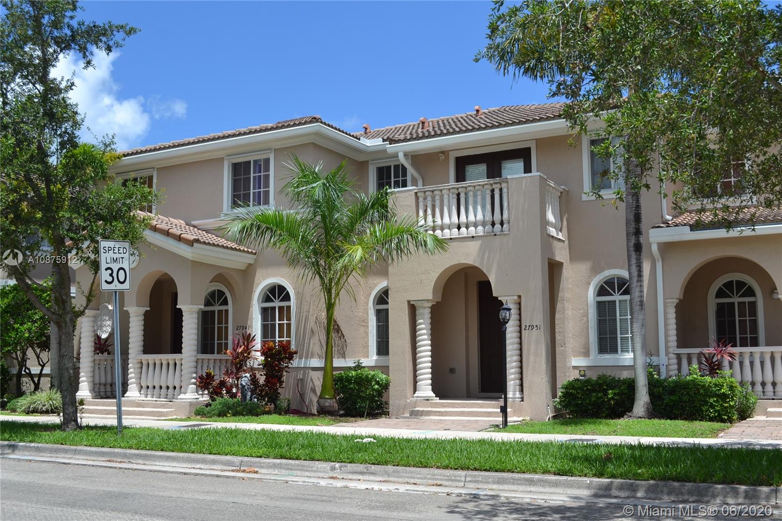 27951 Southwest 140th Avenue Homestead, FL 33032 - Photo 2 of 27 a front view of a house with garden