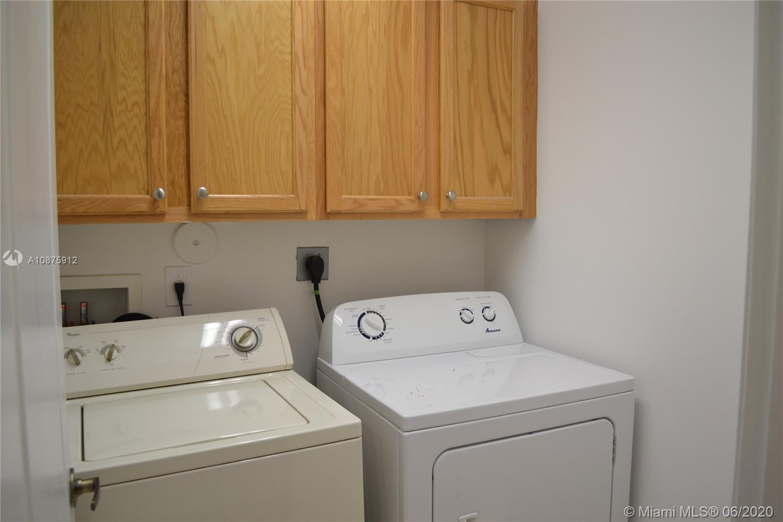 27951 Southwest 140th Avenue Homestead, FL 33032 - Photo 21 of 27 a utility room with dryer and washer
