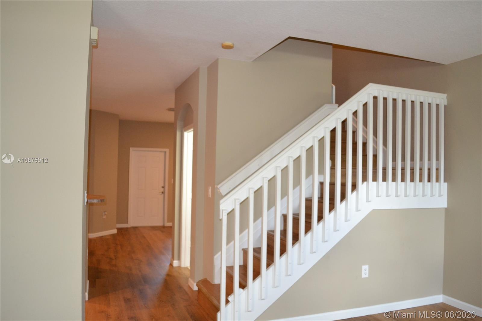 27951 Southwest 140th Avenue Homestead, FL 33032 - Photo 24 of 27 a view of an entryway with wooden floor