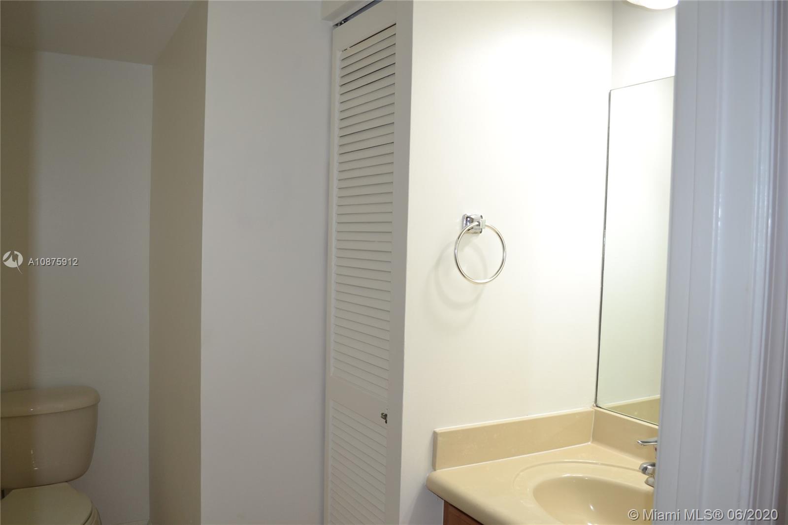 27951 Southwest 140th Avenue Homestead, FL 33032 - Photo 8 of 27 a bathroom with a granite countertop toilet and a sink