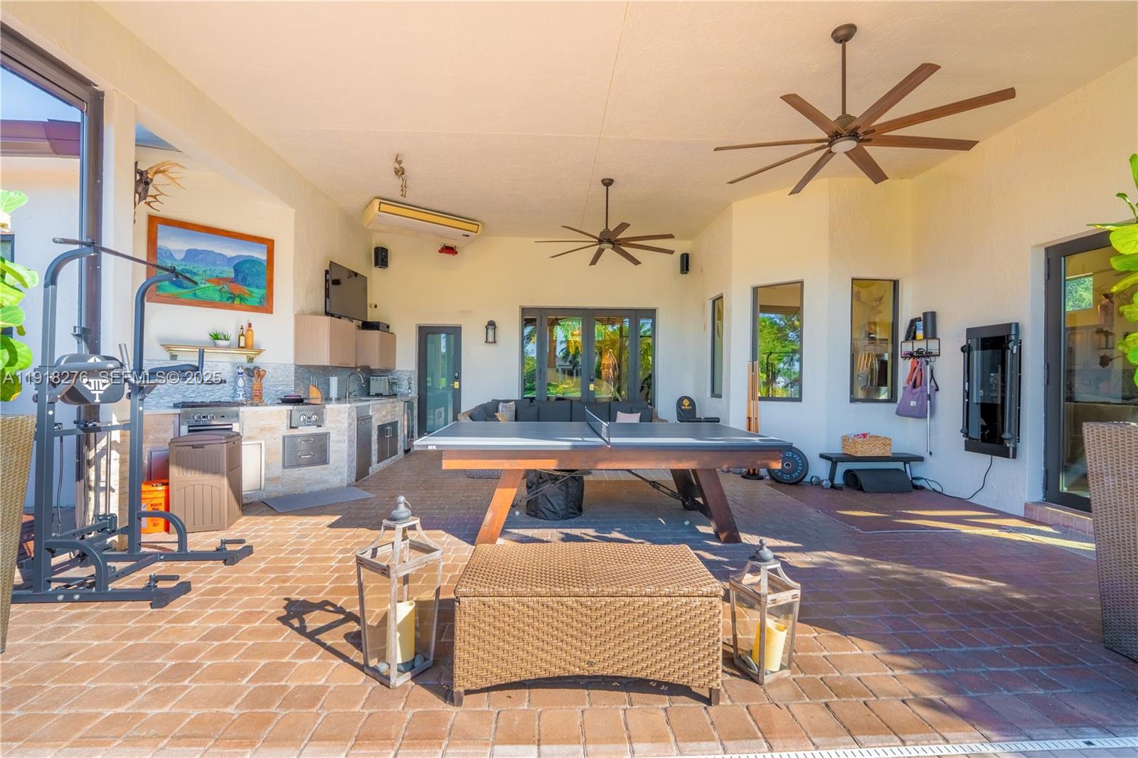 13372 Southwest 40th Street Davie, FL 33330 - Photo 12 of 22 a living room with patio furniture and a large window