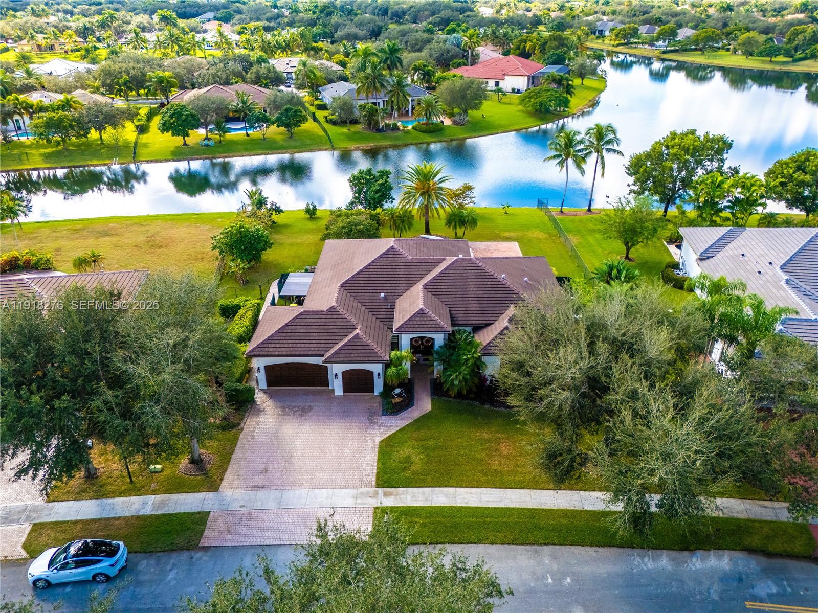13372 Southwest 40th Street Davie, FL 33330 - Photo 3 of 22 an aerial view of a house with outdoor space and lake view