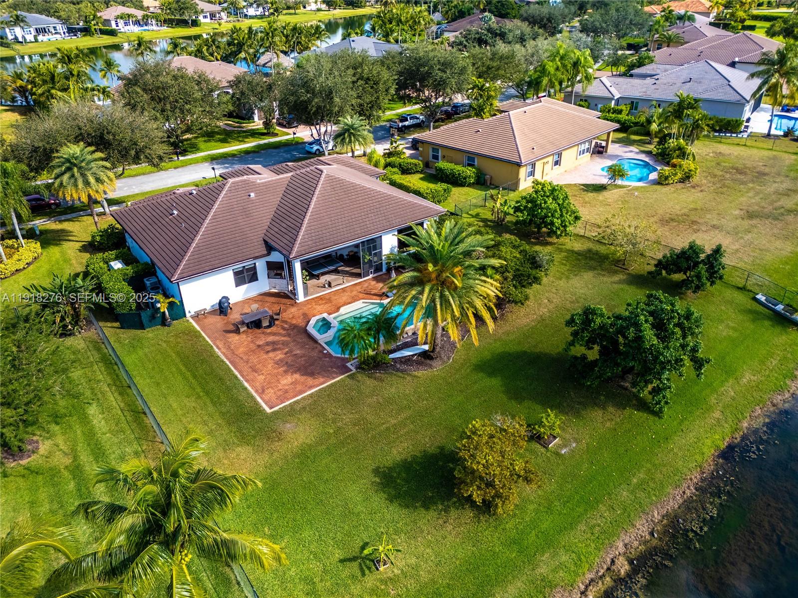 13372 Southwest 40th Street Davie, FL 33330 - Photo 4 of 22 an aerial view of residential houses with outdoor space and swimming pool