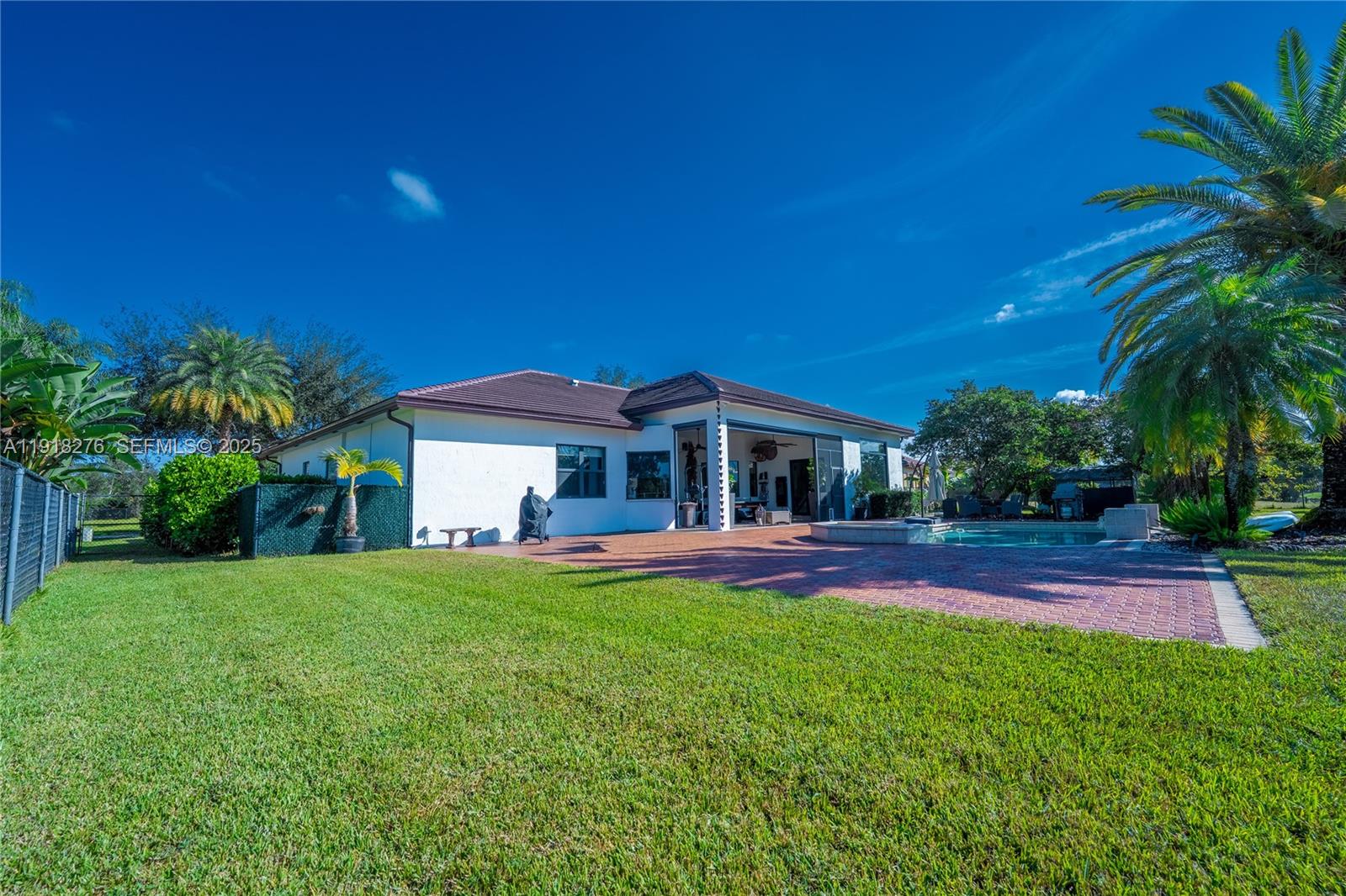13372 Southwest 40th Street Davie, FL 33330 - Photo 5 of 22 a front view of house with yard and outdoor seating