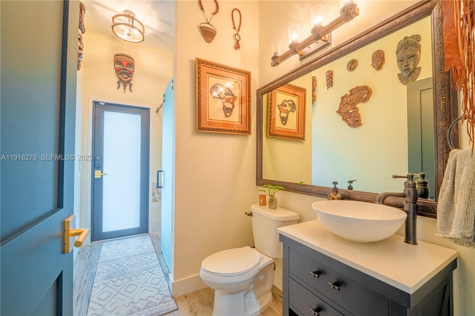 13372 Southwest 40th Street Davie, FL 33330 - Photo 6 of 22 a bathroom with a granite countertop toilet sink and mirror