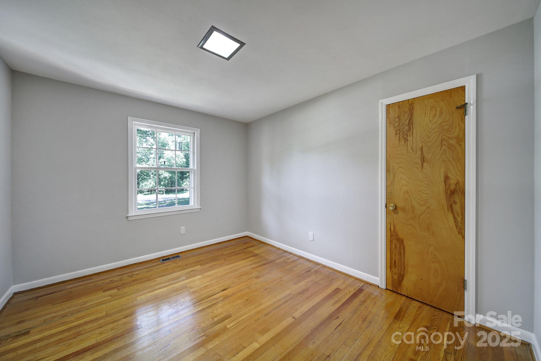 967 State Rd S-29-376 Lancaster, SC 29720 - Photo 16 of 33 a view of an empty room with wooden floor and a window