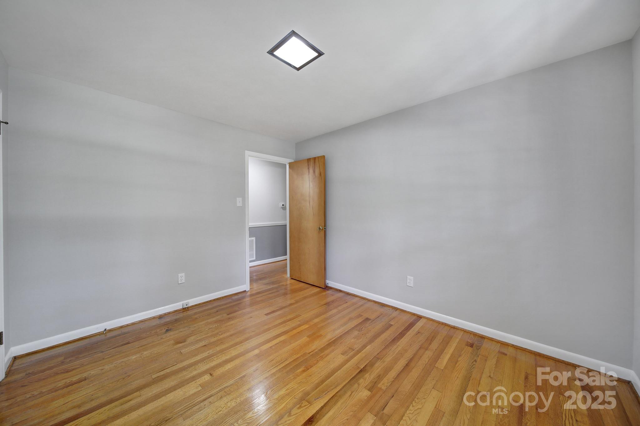 967 State Rd S-29-376 Lancaster, SC 29720 - Photo 17 of 33 a view of an empty room with wooden floor