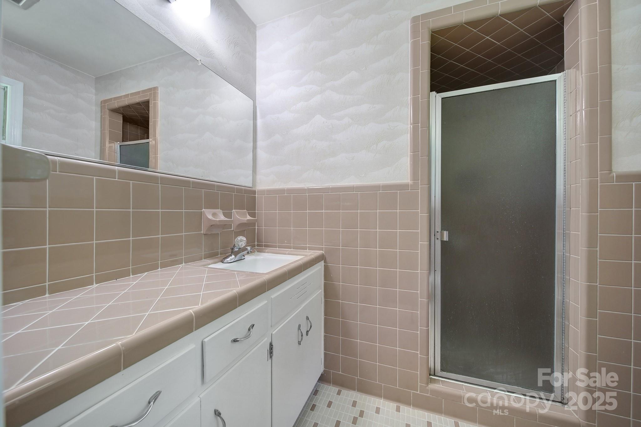 967 State Rd S-29-376 Lancaster, SC 29720 - Photo 24 of 33 a bathroom with a granite countertop sink a shower and a mirror
