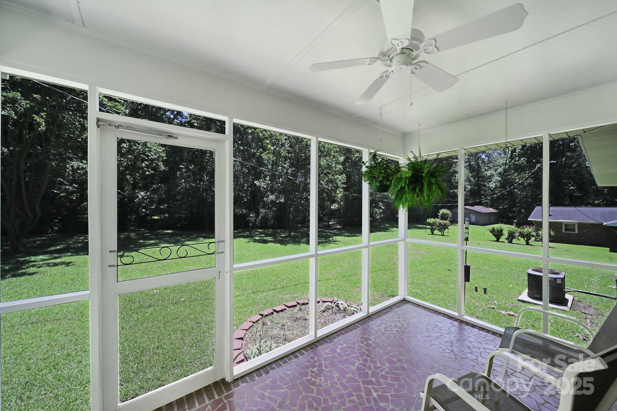 967 State Rd S-29-376 Lancaster, SC 29720 - Photo 27 of 33 a view of a backyard with porch and garden