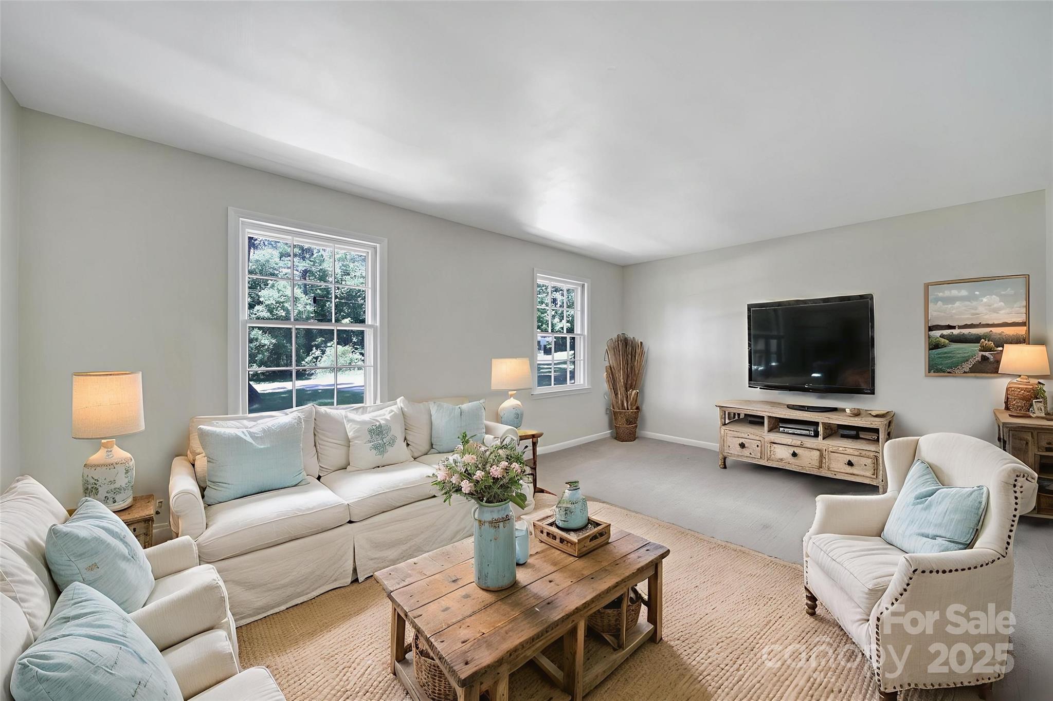 967 State Rd S-29-376 Lancaster, SC 29720 - Photo 5 of 33 a living room with furniture couches and a flat screen tv