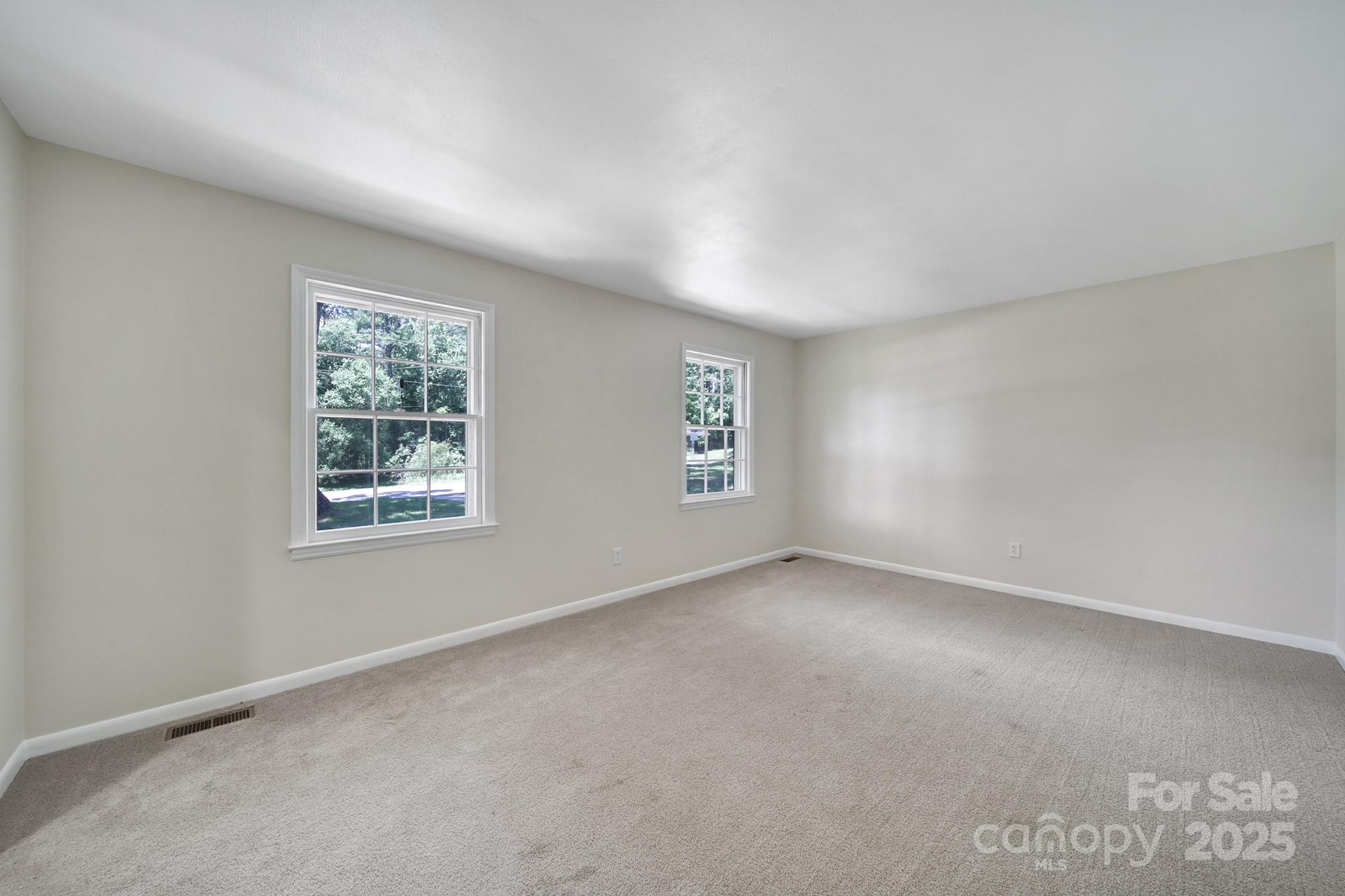 967 State Rd S-29-376 Lancaster, SC 29720 - Photo 6 of 33 an empty room with windows