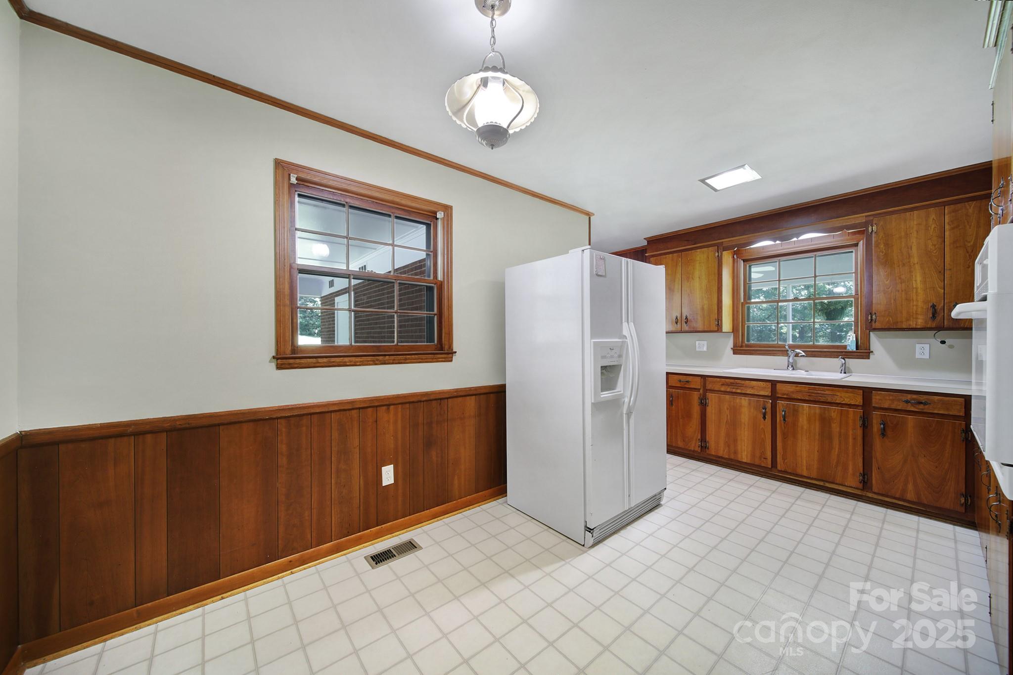 967 State Rd S-29-376 Lancaster, SC 29720 - Photo 10 of 33 a kitchen with refrigerator and window
