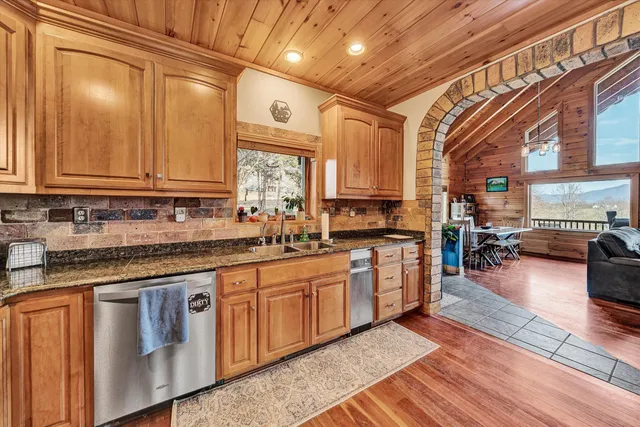 a kitchen with stainless steel appliances a refrigerator and a stove