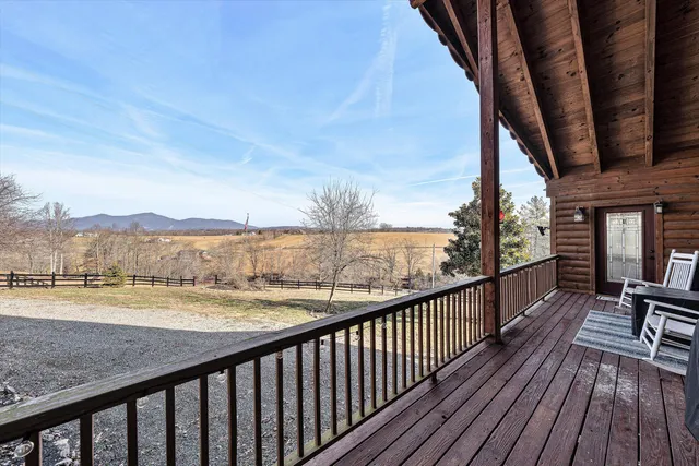 a view of a balcony with wooden floor