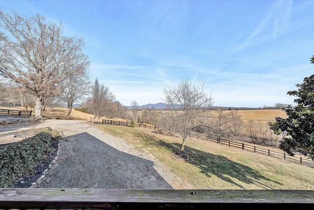 a view of balcony with wooden floor