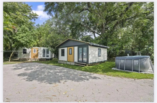 a backyard of a house with wooden fence