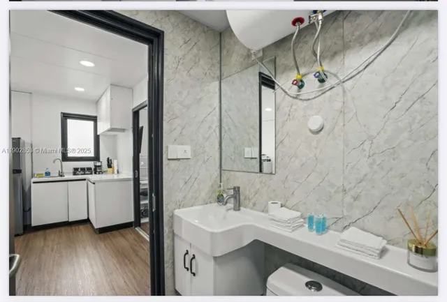 a bathroom with a sink and a mirror