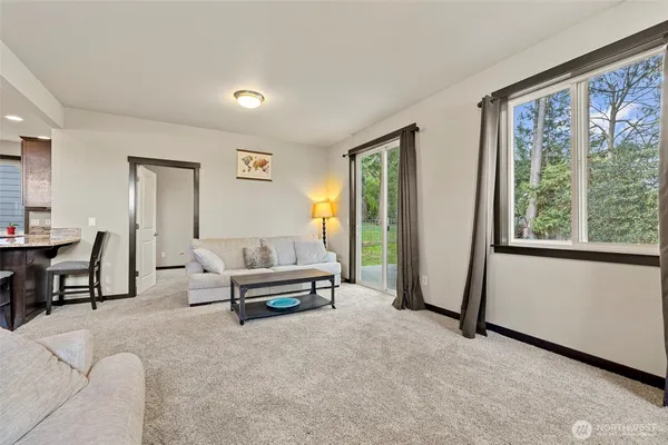 a living room with furniture and a large window