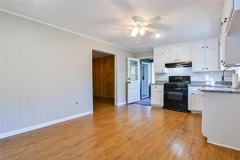 8196 Lakeview Drive Southwest Covington, GA 30014 - Photo 15 of 51 a view of kitchen with wooden floor electronic appliances and window