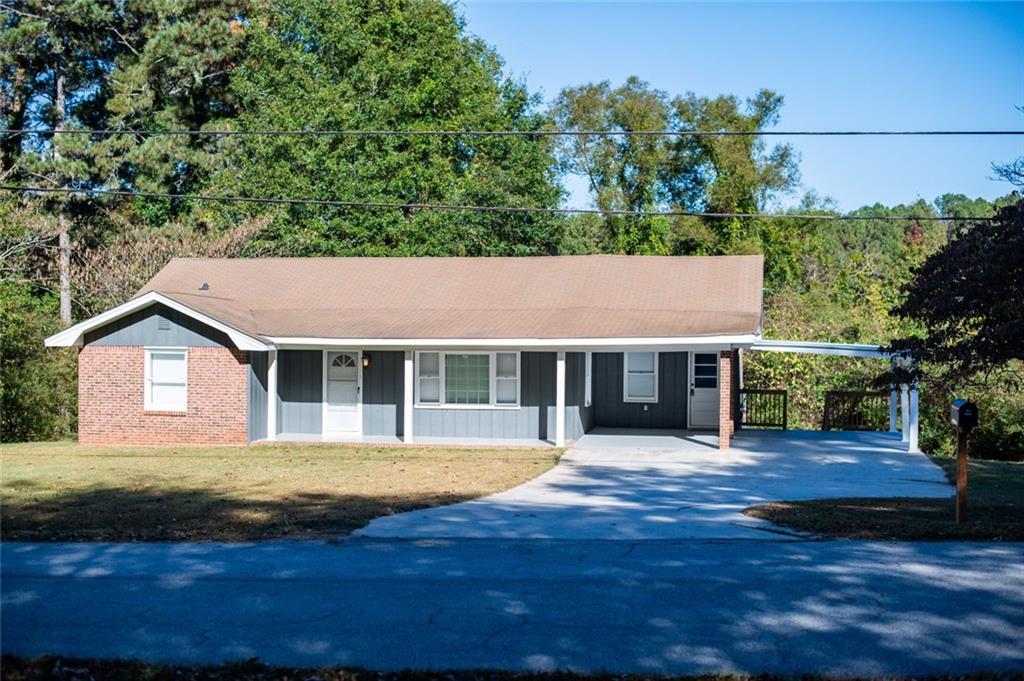8196 Lakeview Drive Southwest Covington, GA 30014 - Photo 2 of 51 a house with trees in the background