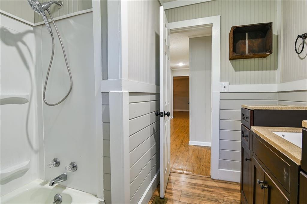 8196 Lakeview Drive Southwest Covington, GA 30014 - Photo 25 of 51 a bathroom with a sink a toilet and shower