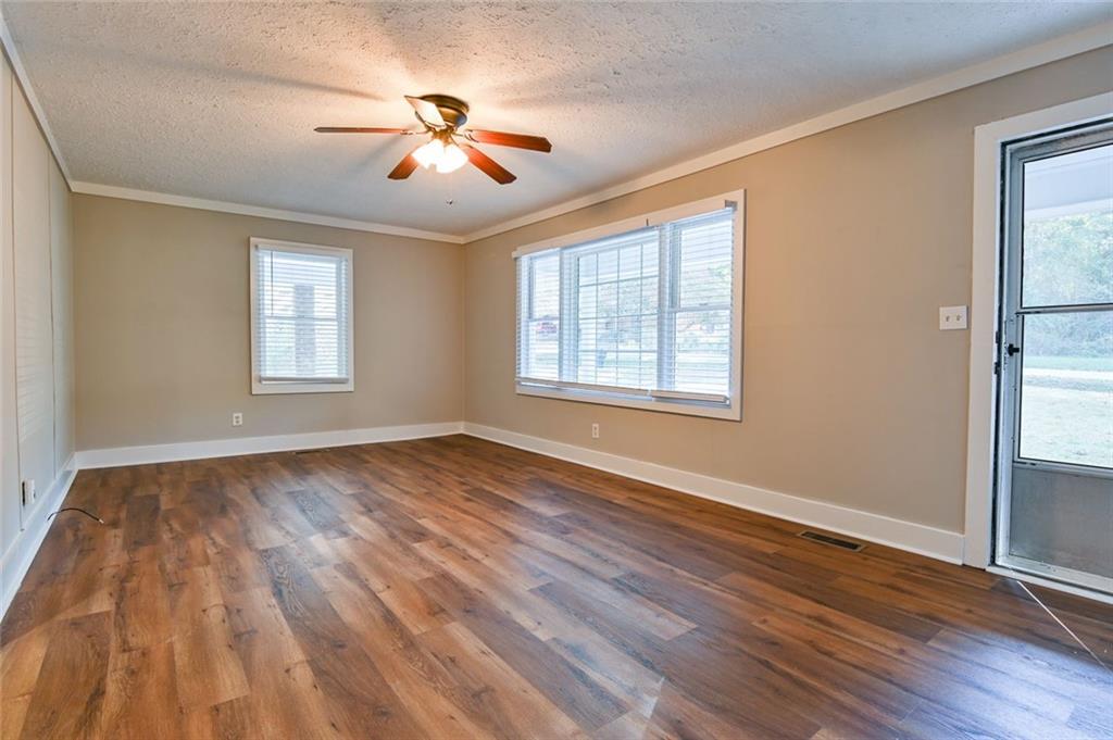 8196 Lakeview Drive Southwest Covington, GA 30014 - Photo 27 of 51 a view of empty room with wooden floor and fan