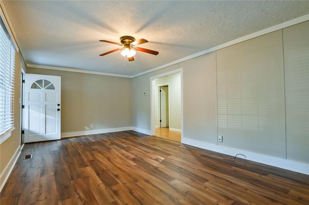 8196 Lakeview Drive Southwest Covington, GA 30014 - Photo 28 of 51 a view of empty room with wooden floor and fan