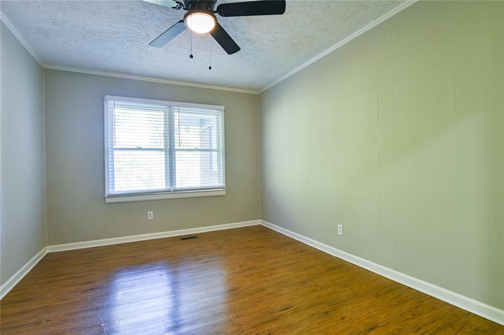 8196 Lakeview Drive Southwest Covington, GA 30014 - Photo 29 of 51 wooden floor in an empty room with a window